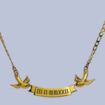 Gold necklace with matching birds holding an engravable banner with a date engraved on the banner